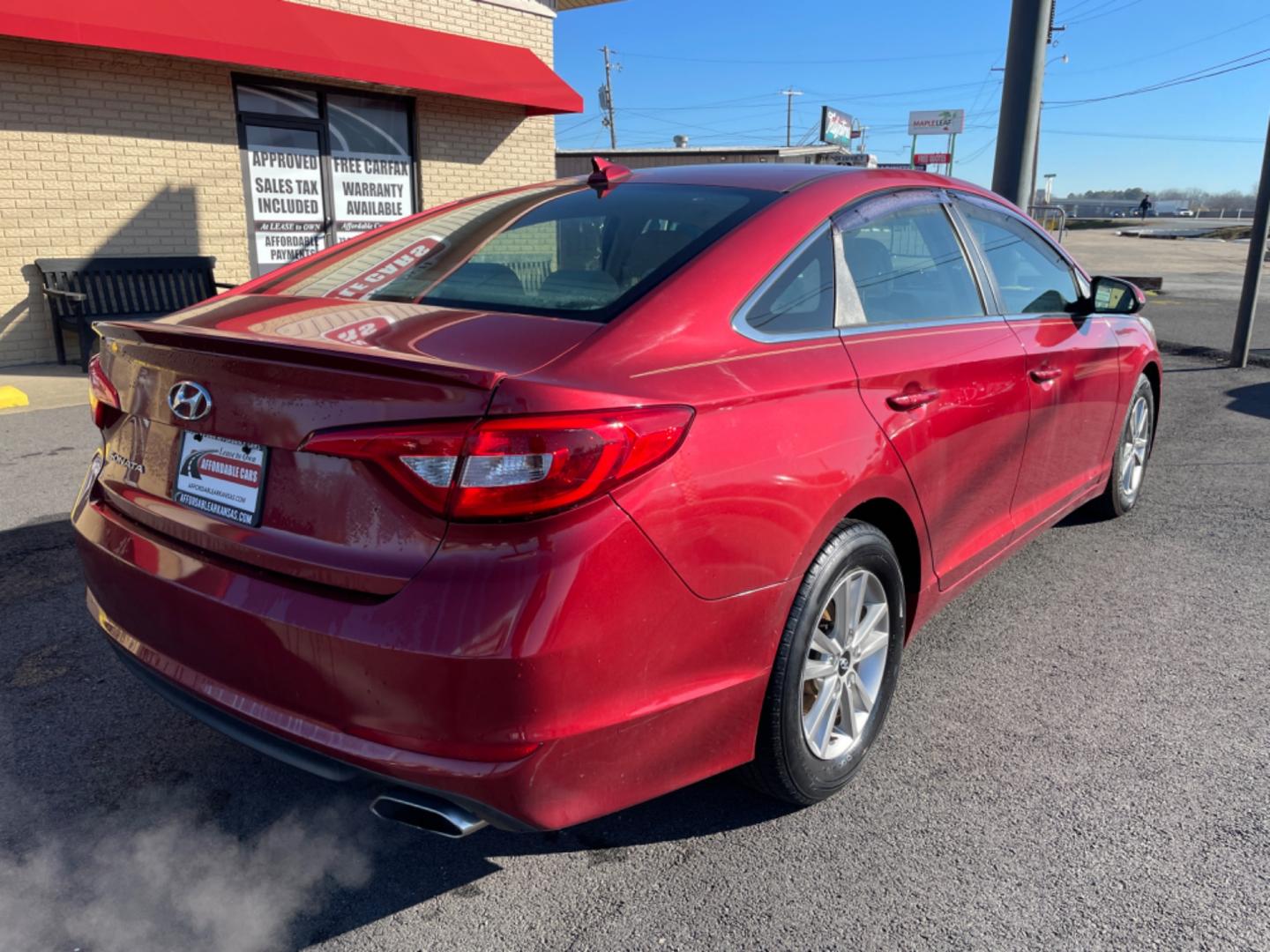 2016 Maroon Hyundai Sonata (5NPE24AF6GH) with an 4-Cyl, 2.4 Liter engine, Auto, 6-Spd w/Shiftronic and Drive Mode Select transmission, located at 8008 Warden Rd, Sherwood, AR, 72120, (501) 801-6100, 34.830078, -92.186684 - Photo#7